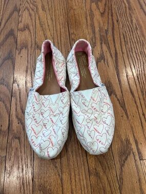 Toms White Canvas Slip-Ons with Pink Heart Print